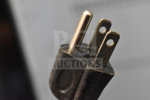 Close-up of a power plug, standard three-prong design, suitable for IDW G-11-C33EB cooler, 115 volts, 1 phase.