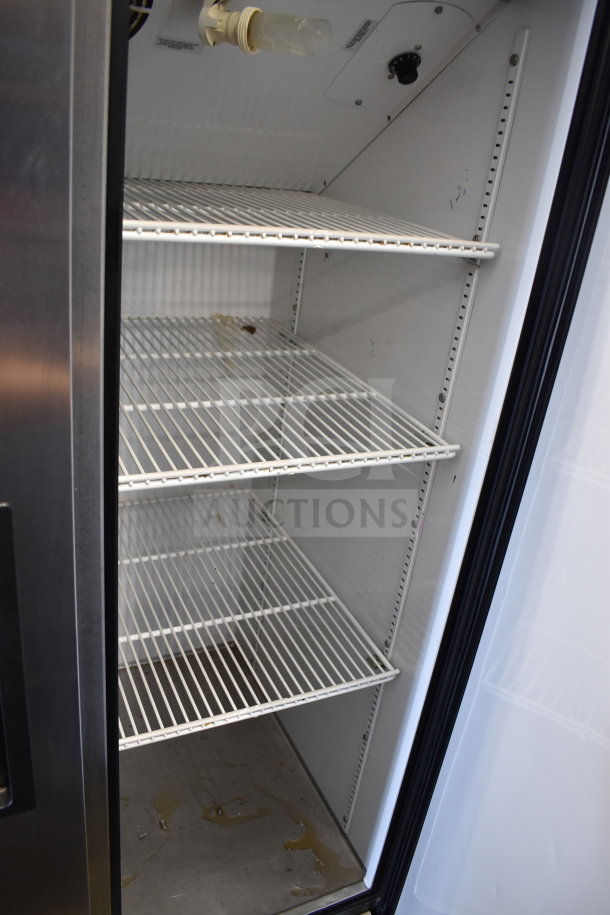 True T-35 commercial 2-door reach-in cooler, 115 volts, 1 phase, shown open with empty shelves and some interior stains.