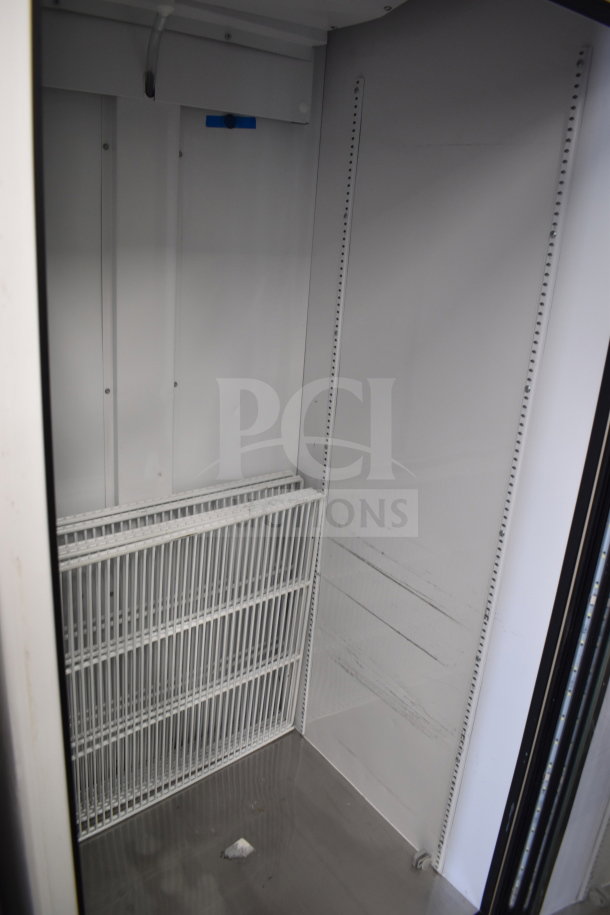2021 True TSCI-600R-G-PH commercial cooler interior, single door, white shelving, clean condition.