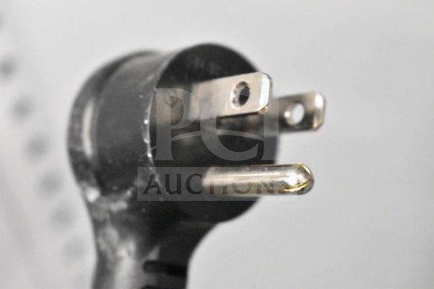 Close-up of a 3-prong plug end for 2021 True TSCI-600R-G-PH Commercial Cooler, 110-120V, 1 Phase.