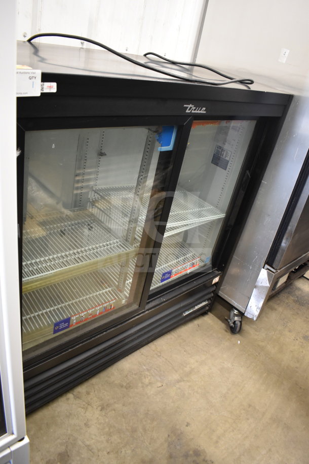 2020 True GDM-41SL-48-HC-LD commercial cooler, black, glass doors, 115V, 1 phase, excellent condition, visible shelving.