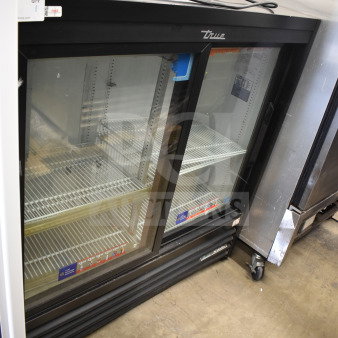 2020 True GDM-41SL-48-HC-LD commercial cooler, black, glass doors, 115V, 1 phase, excellent condition, visible shelving.