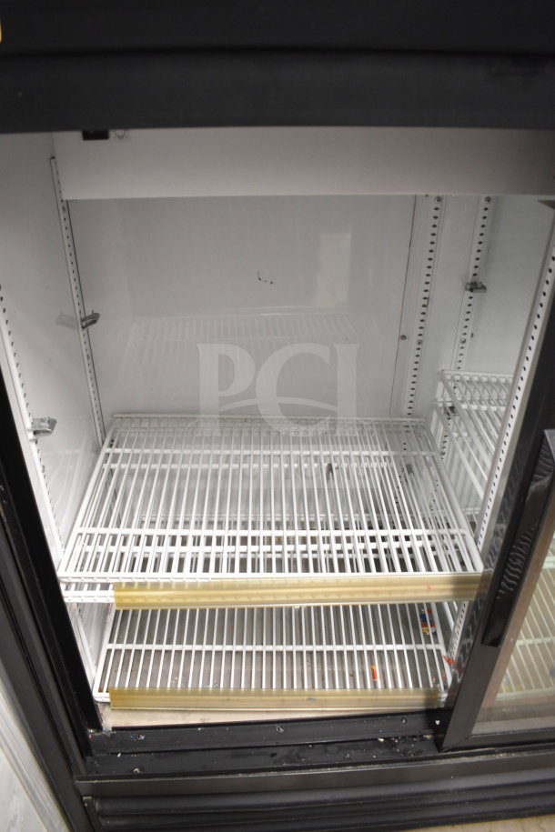 2020 True GDM-41SL-48-HC-LD commercial cooler, 2-door reach-in merchandiser, 115V, 1 phase, clean interior shelves.