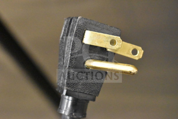 Close-up of a 115V electrical plug for a 2020 True T-35-HC Commercial 2 Door Reach-In Cooler.