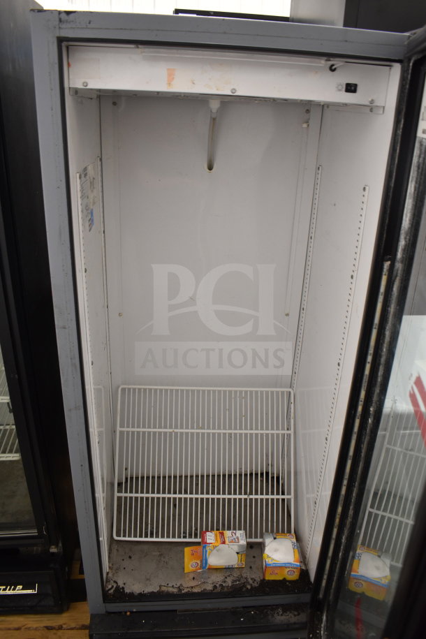 True GDM-12-LD Commercial Single Door Reach-In Cooler, 115 volts, 1 phase, interior shelves, visible wear.