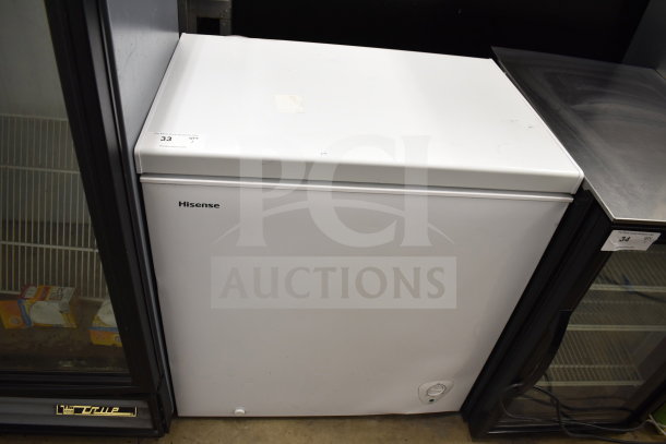 Hisense WFC070M6RWD chest freezer, white, 115 volts, 1 phase, in good condition. Markings show item number 33.
