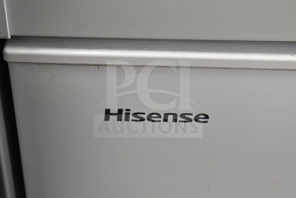 Hisense WFC070M6RWD chest freezer, 115 volts, 1 phase, white, minor wear, visible branding on front panel.