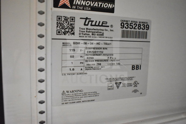 2018 True GDM-06-34-HC commercial cooler label, detailing model, voltage (115V), refrigerant type R290, and serial number.