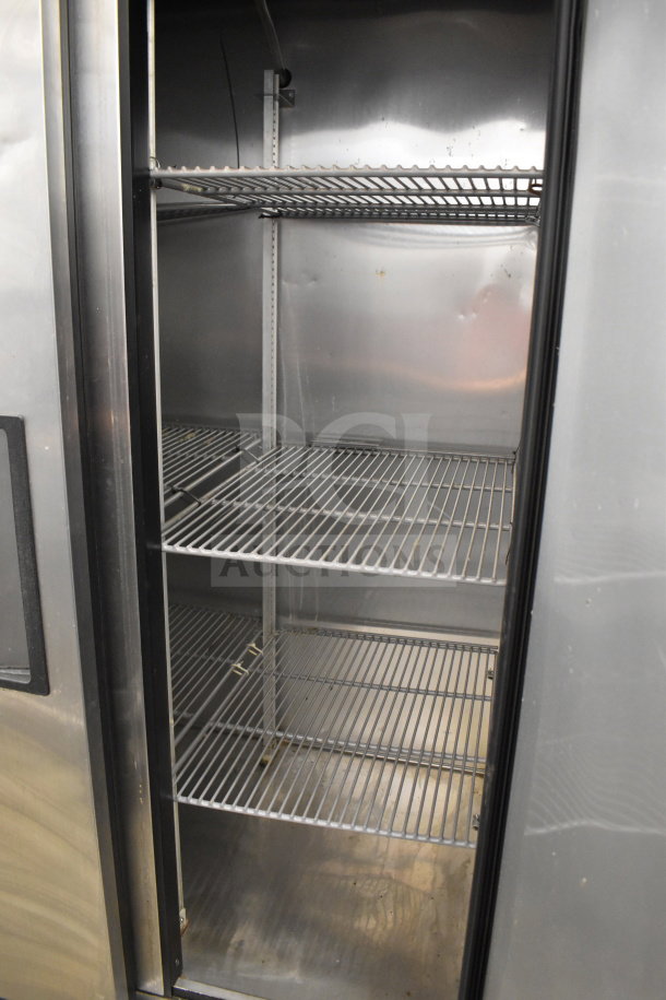 2017 True T-35 commercial 2-door cooler, stainless steel interior, multiple shelves, 115V, 1 phase, well-maintained.