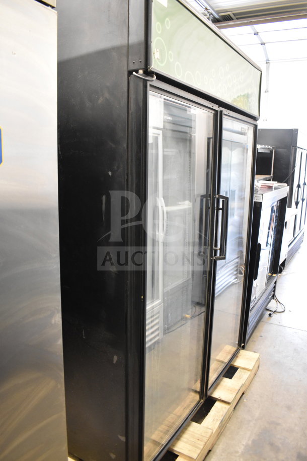 True GDM-52TM-RL-LD 2 Door Reach In Cooler Merchandiser, black exterior, glass doors, commercial use, 115V, good condition.