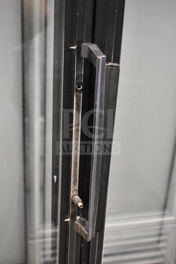 True GDM-52TM-RL-LD cooler handle detail, black finish, commercial-grade. Shows wear, sturdy design, 115V, 1 phase.