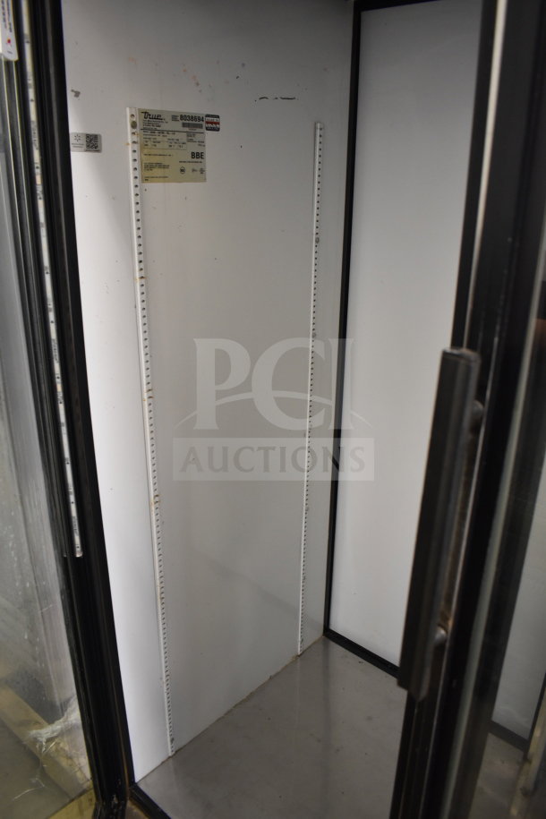 True GDM-52TM-RL-LD cooler merchandiser, 2-door, 115 volts, 1 phase, commercial use, visible labeling inside, clean interior.
