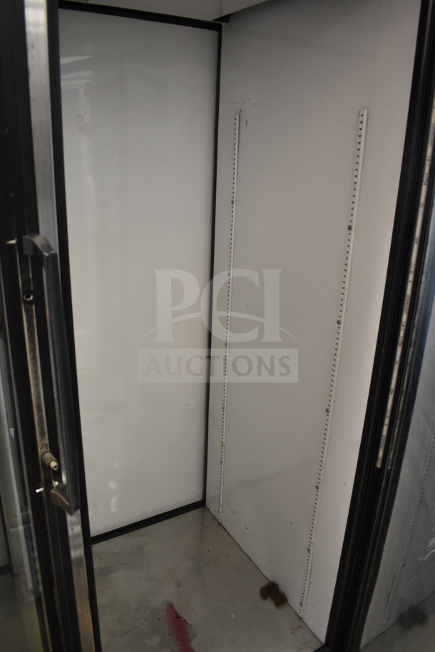 True GDM-52TM-RL-LD Commercial 2 Door Cooler; interior view, signs of wear; 115V, 1 Phase.