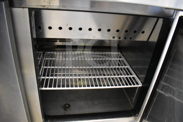 Everest EPBR2 commercial prep table interior, featuring wire shelf with ventilation holes above, stainless steel finish.