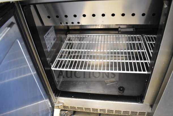 Everest EPBR2 commercial sandwich salad prep table, interior view showing shelving, clean condition, visible Everest label.