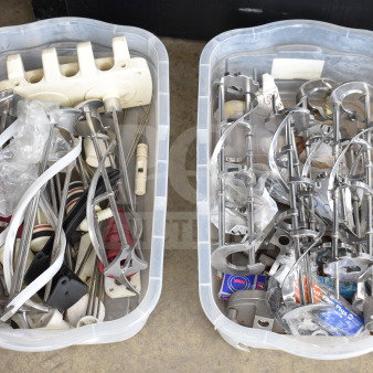 Lot of two bins with various ice cream machine parts including augers, in used condition.