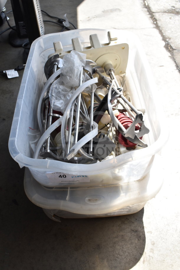 Two bins of various ice cream machine parts, including augers, in mixed condition. Auction lot number 40 label visible.