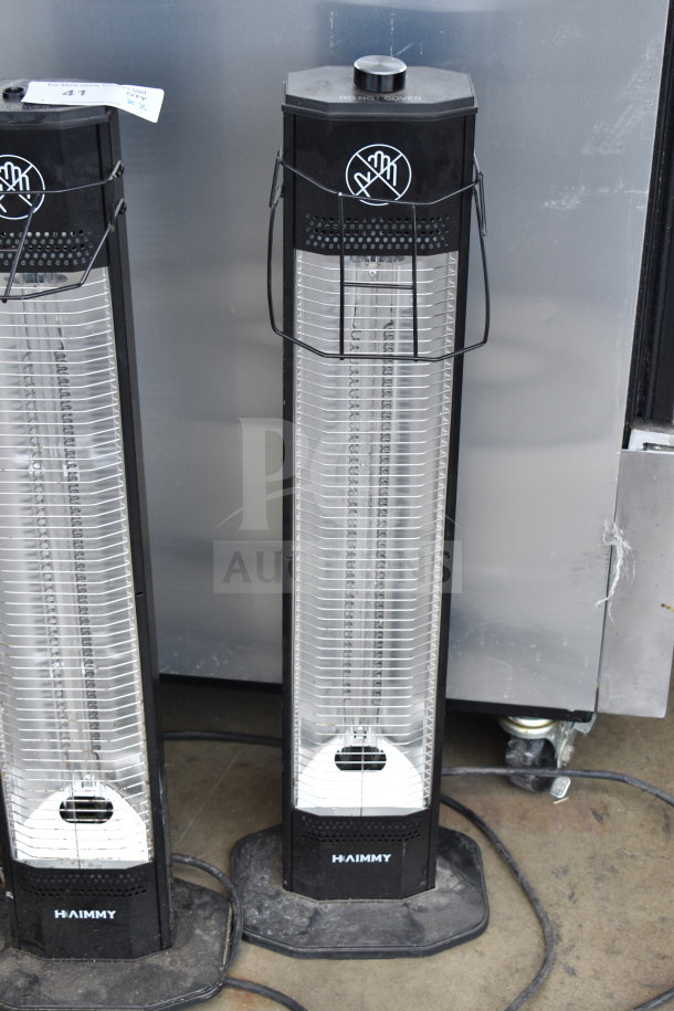 Two Haimmy UEH520 infrared electric heaters, 120 volts, 1 phase, in good condition. Labels indicate caution to not cover.