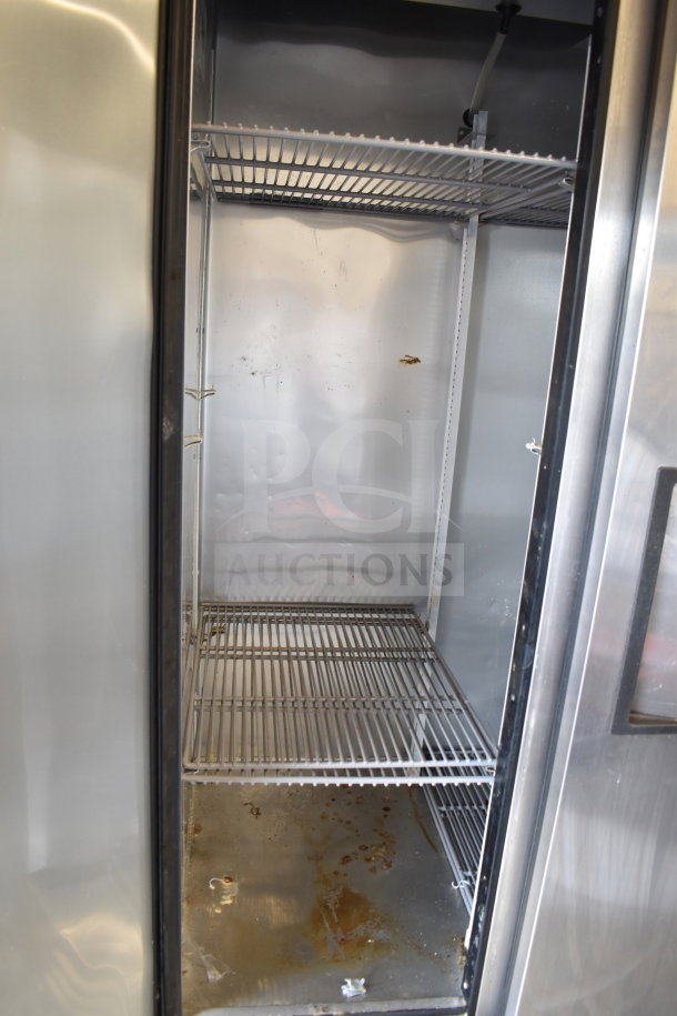 2017 True T-35-HC 2-door reach-in cooler, on commercial casters, some interior wear visible. 115V, single phase.