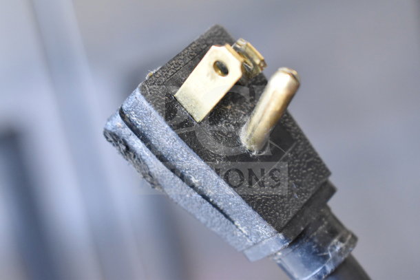 Close-up of a power plug for a 2017 True T-35-HC Commercial Cooler, showing its condition and prongs detail.