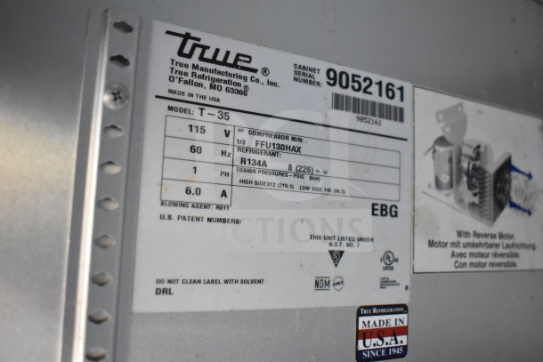 Label on 2017 True T-35-HC Commercial 2 Door Cooler, showing model, voltage, refrigerant details, and made in USA mark.