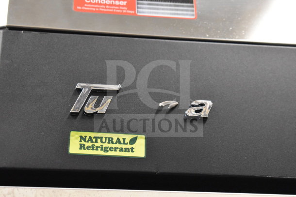 Turbo Air M3F24-1-N freezer logo detail showing a missing letter; natural refrigerant label visible.
