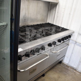 Mainstreet 541E60N commercial range with 10 burners, 2 ovens, overshelf, and backsplash. Natural gas. Good condition.