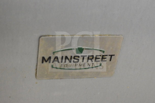 Mainstreet 541E60N logo on commercial range. Natural gas 10-burner with 2 ovens, over shelf, backsplash.