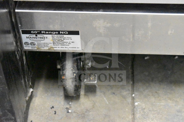 Mainstreet 541E60N commercial natural gas 10 burner range with 2 ovens. Image shows the 60" range label detailing model and specs.