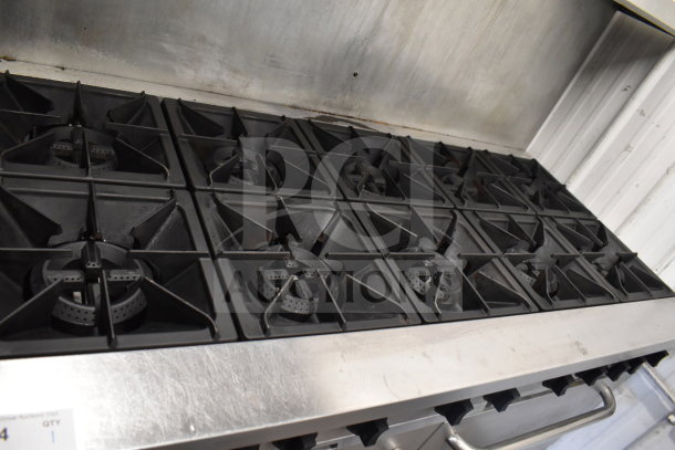 Mainstreet 541E60N commercial range with 10 burners, 2 ovens, overshelf, and backsplash. Natural gas. Good condition.