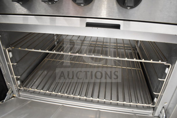 Mainstreet 541E60N range oven interior, featuring durable stainless steel racks. Clean and spacious condition.