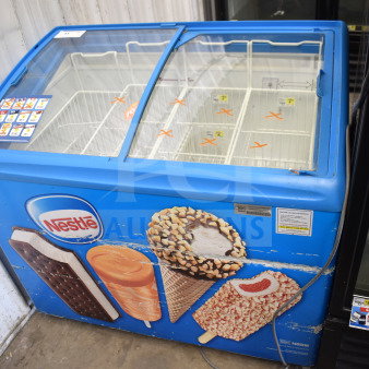 AHT RIO S 100 commercial chest freezer, blue exterior with ice cream graphics, glass sliding doors; 115V, 1 phase.