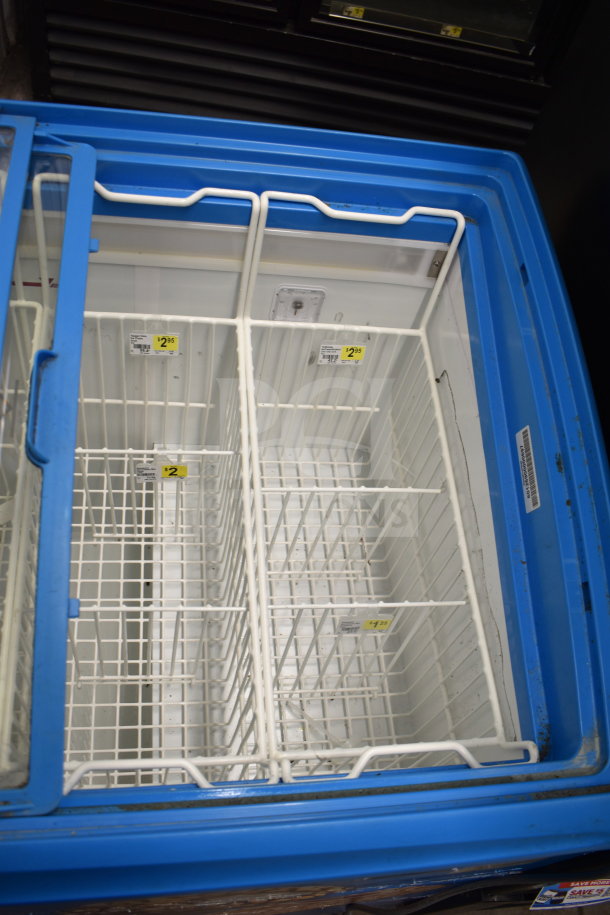 AHT RIO S 100 commercial chest freezer merchandiser in good condition. Features wire baskets, 115 volts, 1 phase.