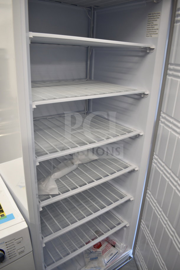 Brand new KoolMore KM-FMD20WH single door freezer, scratch and dent condition, spacious interior with multiple shelves.