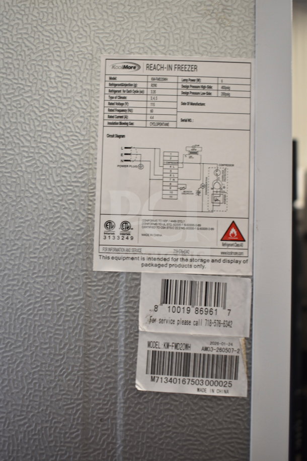 BRAND NEW SCRATCH AND DENT KoolMore KM-FMD20WH Commercial Single Door Reach In Freezer with visible labels and model info.