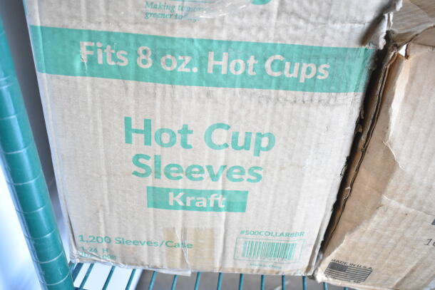 Two brand new boxes containing 500COLLAR8BR EcoChoice 8 oz. Kraft coffee cup sleeves.