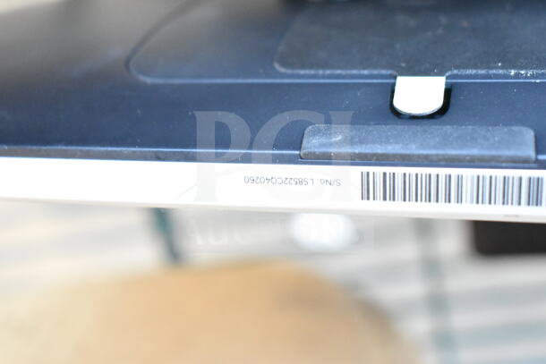 Two Toast POS monitors, black, shown with serial number label. Good condition, barcode visible.