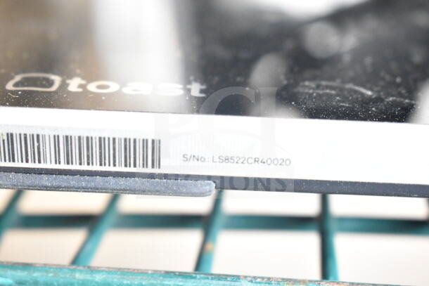 2 Toast POS monitors with visible brand logo and serial number LS8522CR40020; condition appears used.
