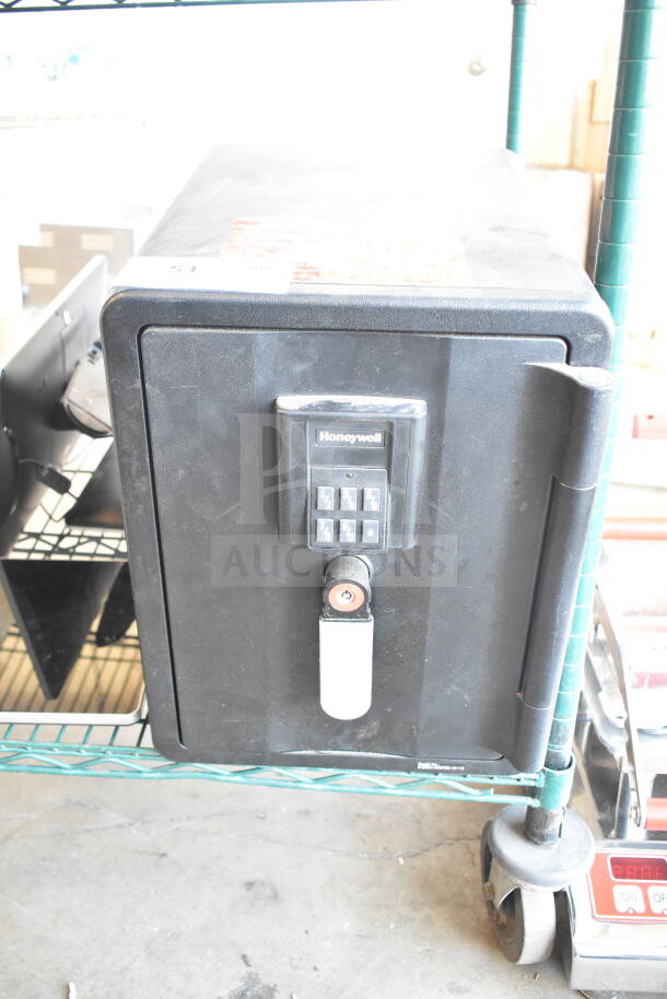 Honeywell single door safe, black, keypad entry. No combination included. Used condition.