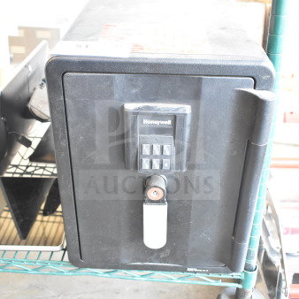 Honeywell single door safe, black, keypad entry. No combination included. Used condition.