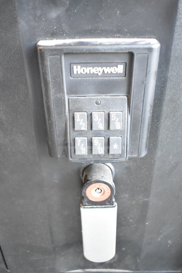Honeywell single door safe with keypad lock, does not come with combination. Used condition, black finish.