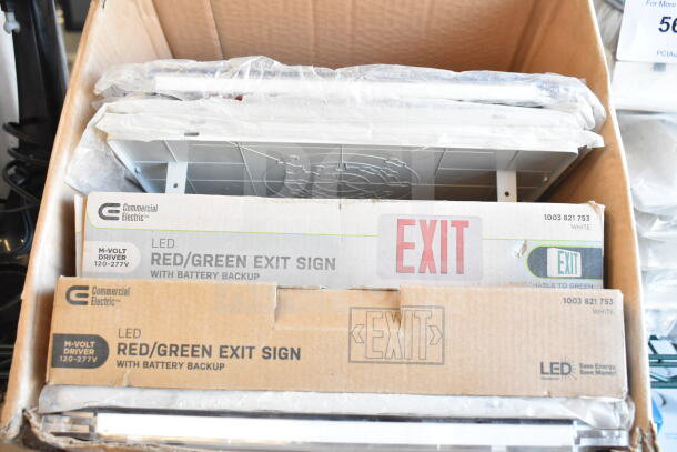 Cardboard box with Commercial Electric LED red/green exit signs, model 1003 821 753, with battery backup. Contains multiple items.