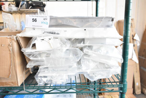 Ten various vent covers, packaged and stacked, with auction label indicating quantity of 10. Good condition.