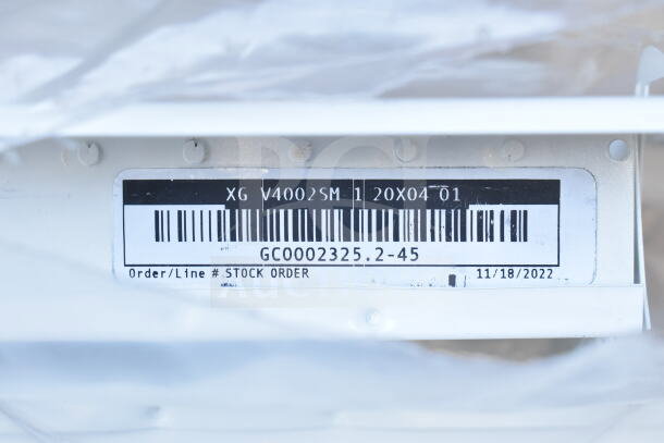 Vent cover with label XG V4002SM, 20x04, stock order GC0002325.2-45, dated 11/18/2022. Lot of 10.