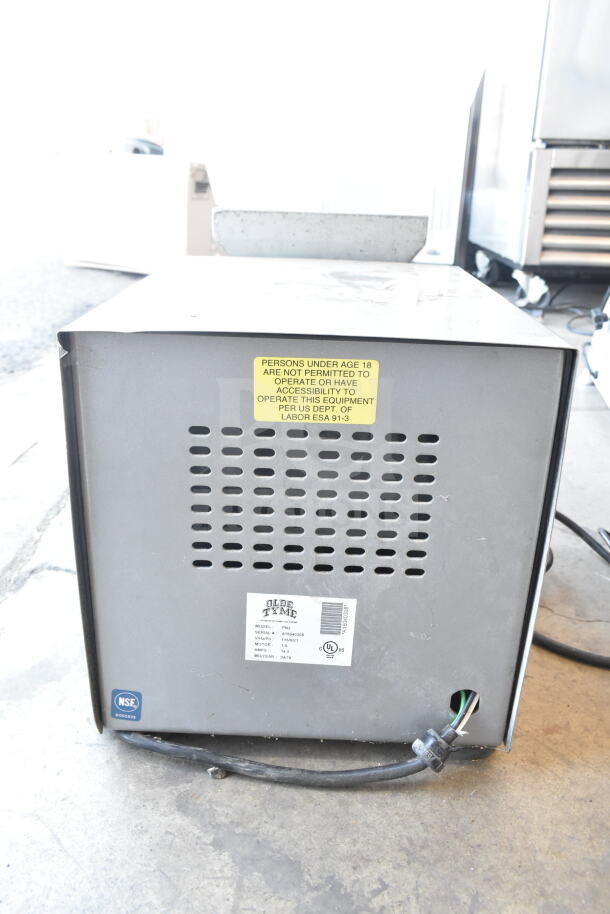 Old Tyme PN2 nut grinder base, countertop model with hopper mount; 115V, 1 phase. Visible labels show model and safety info.