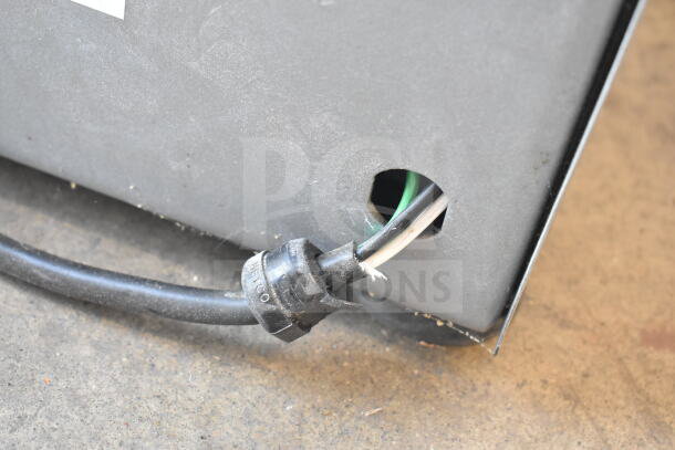 Old Tyme PN2 nut grinder base, gray metal, with hopper mount port. Condition shows wear. Visible power cable, 115V, 1 Phase.