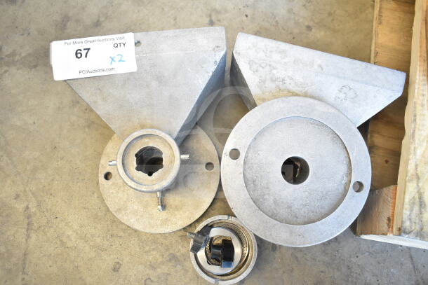Two front metal pieces for Old Tyme Nut Grinder. Visible wear. Includes a mounting hole. Auction quantity x2.