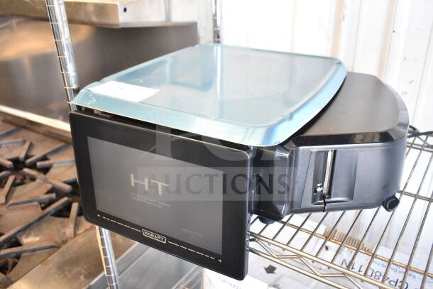 Hobart HTi commercial countertop food portioning scale, 120/208-240 Volts, 1 Phase, tested and working, on metal shelf.