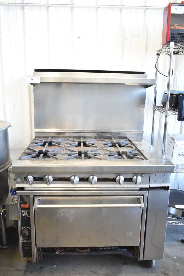 Jade Range commercial gas 6-burner range with oven, over shelf, back splash, and commercial casters; in good condition.