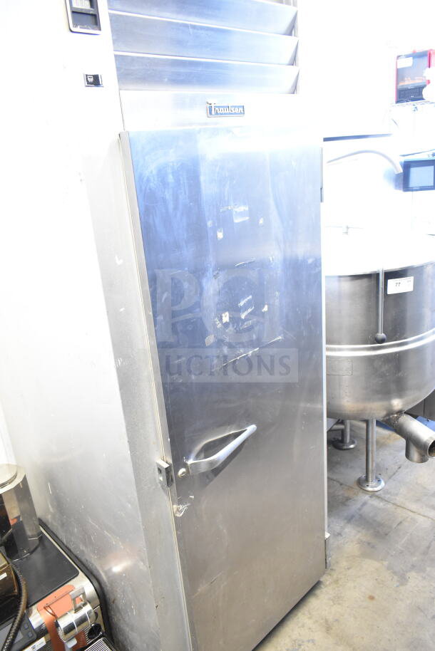 Traulsen G10010 commercial single door reach-in cooler, 115 volts, 1 phase. Visible wear, stainless steel, single door handle.